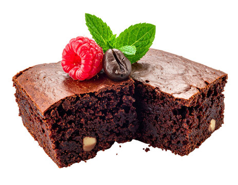 Two rich chocolate brownies garnished with fresh raspberry mint and coffee bean