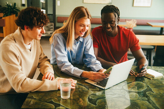 Professional teamwork in office with laptop, film photo