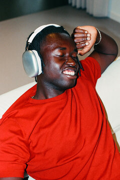 Man listening to music with headphones film photo