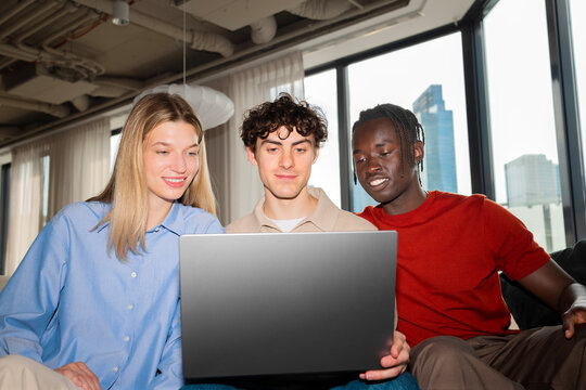 Woman and man teamwork with laptop in modern office for business