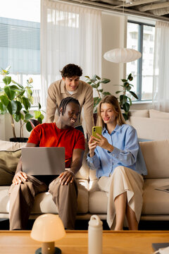 Collaborative Teamwork with Laptop and Smartphone in Office