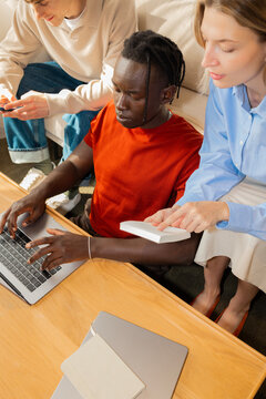 Teamwork with man and woman using laptop in office