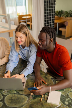 Business teamwork with laptop in coworking workplace