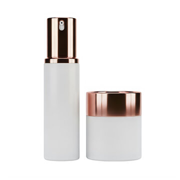 White cosmetic bottles with rose gold pump and lid on black container skincare