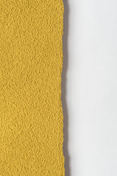 Vertical hojicha powder texture with rough organic edge and white copy space suits tea posters, packaging and wellness design.