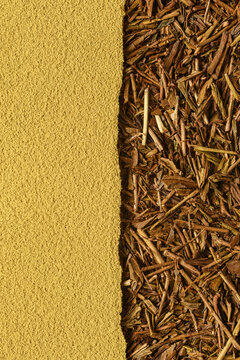 Hojicha powder and roasted tea leaves form warm split background with natural texture and generous copy space for design.