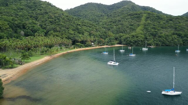 Boats anchored in a calm bay. Ilha Grande, Brazil