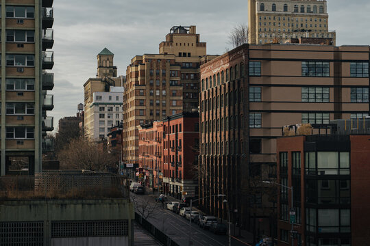 View of the Brooklyn streetscape featuring a mix of historic brick buildings and modern architecture under an overcast sky in Kings County, New York, United States.