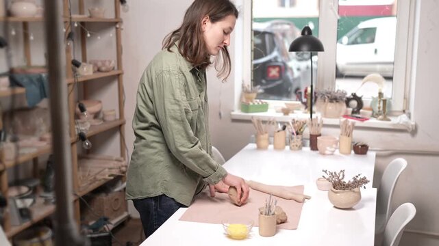 Artisan Kneading Raw Clay by Hand 4K Video. Close-up manual action of clay wedging