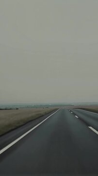 Empty road stretching toward horizon through open plains