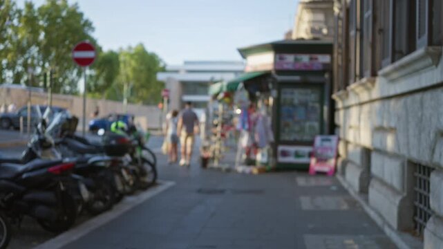 Blurred street scene with shallow bokeh and soft defocused sidewalk and stone facade, street; background backplate copyspace.