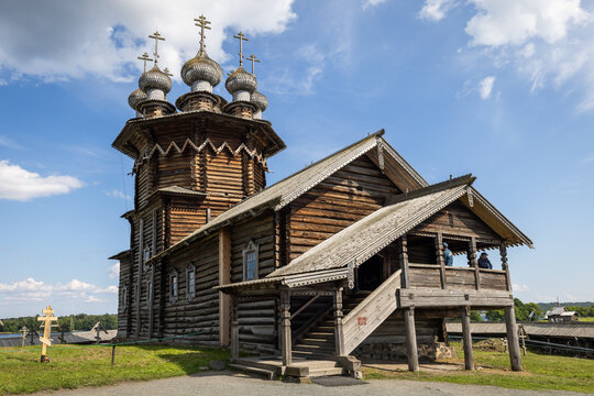 View of the historic wooden Church of the Transfiguration at the Kizhi Pogost, featuring intricate onion domes and traditional log architecture in Petrozavodsk, Republic of Karelia, Russia.