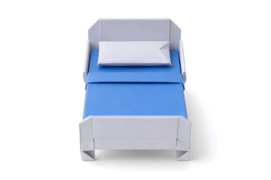 Origami Hospital Bed with Folded Pillow and Blanket in Blue and White Paper Isolated on White Background