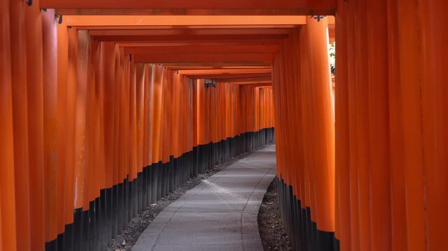 The iconic red torii gates at Fushimi Inari Shrine in Kyoto, Japan.