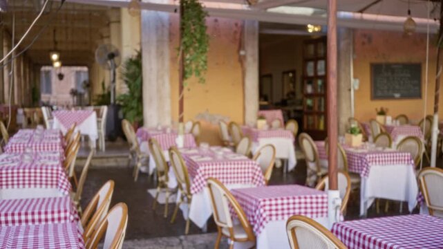 Restaurant terrace with gingham tablecloths in soft blurred bokeh outdoor; template overlay virtual calm.