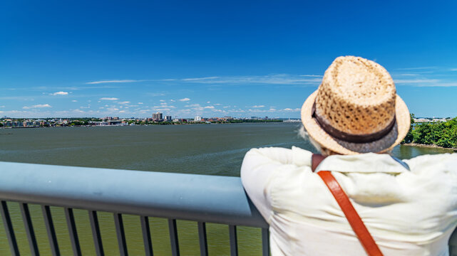 Person Admiring Northern Virginia Skyline Across Potomac River From Washington DC