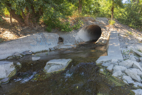 Large round sewage outlet contributing to coastal pollution