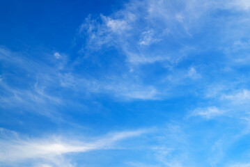 Obraz premium light blue aerial landscape with broad white cloud feathers