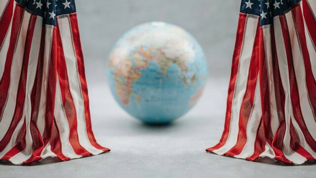 US flags framing a globe. American patriotism and international relations concept.