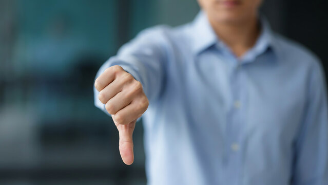 Unrecognizable businessman showing thumbs down gesture as sign of rejection with businessman rejection disapproval feedback decision negative business professional performance critique