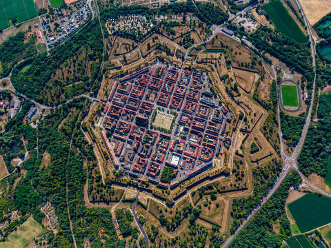 Aerial view of the historic fortified town of Neuf-Brisach with its distinctive star-shaped layout, grid streets, and surrounding ramparts in Neuf-Brisach, Grand Est, France.