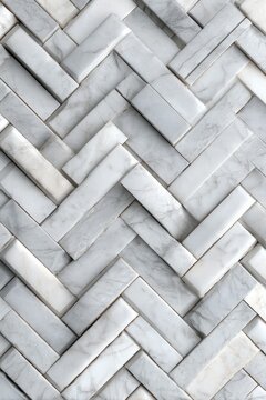 Herringbone pattern of white marble tiles close up full frame architectural detail for luxury interior design and home renovation