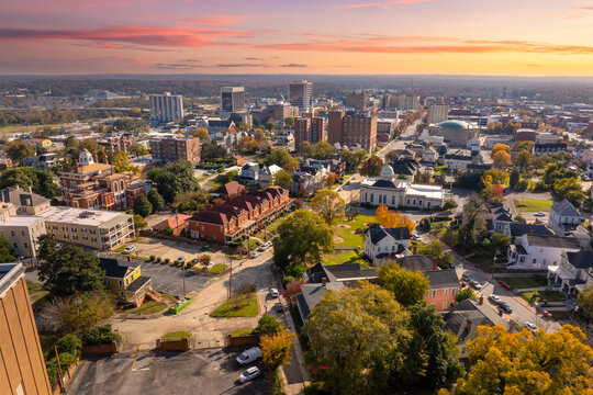 Panoramic aerial cityscape of Macon, Georgia featuring historic buildings, classic southern architecture and urban streets in a traditional American setting.