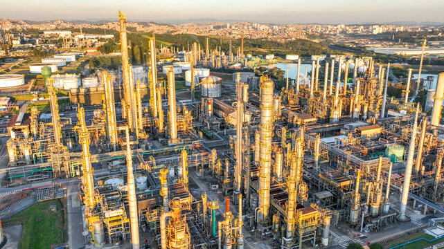 Aerial view of the large petrochemical complex with tall distillation columns, storage tanks, and industrial infrastructure in Santo Andre, State of Sao Paulo, Brazil.