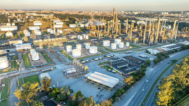 Aerial view of the petrochemical complex featuring storage tanks, industrial towers, and pipelines near a highway in Santo Andre, State of Sao Paulo, Brazil.