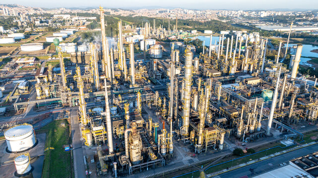 Aerial view of the petrochemical complex with tall distillation columns, storage tanks, and industrial infrastructure in Santo Andre, State of Sao Paulo, Brazil.