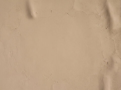 Warm Beige Plaster Wall Texture Background with Copy Space