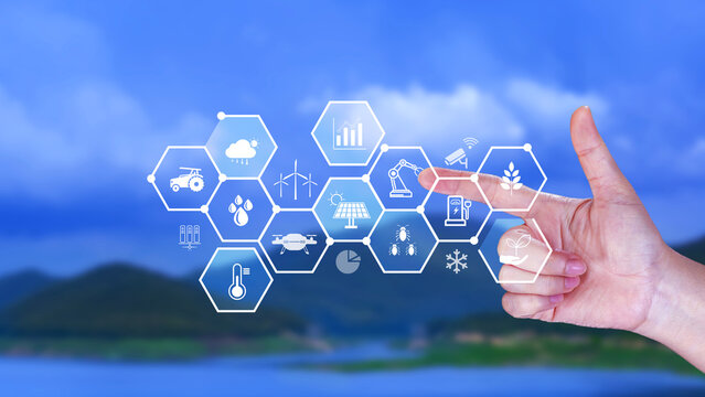 Smart agriculture and agritech concept. Hand using touching digital icons interface of modern farming technology, Agribusiness innovation and smart farming management. not ai
