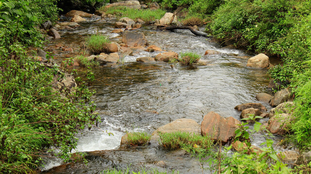Amazing view of water flowing from chinna kallar waterfalls in valparai, Tamil nadu, India.