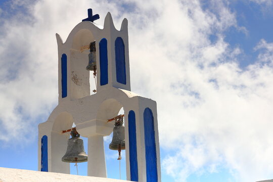 Orthodox Church with its multitiered bell tower facade in Santorini, Greece.