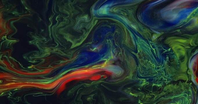 Moving marble texture background. Fluid art of flowing red, blue, green and yellow colors on a black background.