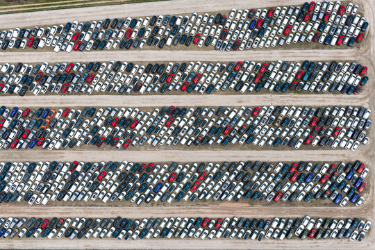 Aerial view of a large parking lot filled with numerous cars at a car forwarding facility in Poland.