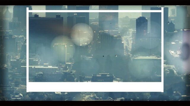 Bokeh orbs drifting and fading, white frame framing hazy skyline, towers emerging revealing city