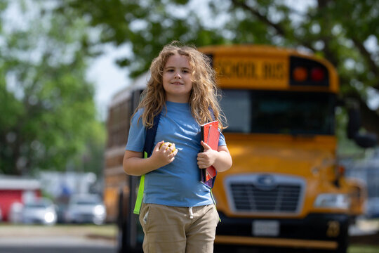 Back to school. School day starts for young student. Kid student with backpack near school bus. Kid go to school. Child going to class. Schoolkid.