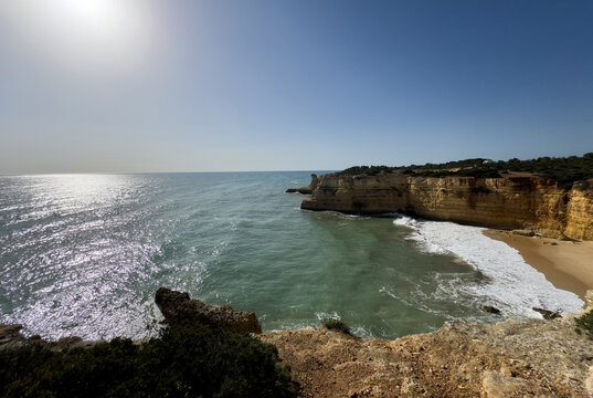 Morena beach, Algarve, Portugal, rock formation cliff in southern Portugal at sunrise