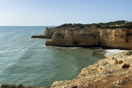 Morena beach, Algarve, Portugal, rock formation cliff in southern Portugal at sunrise