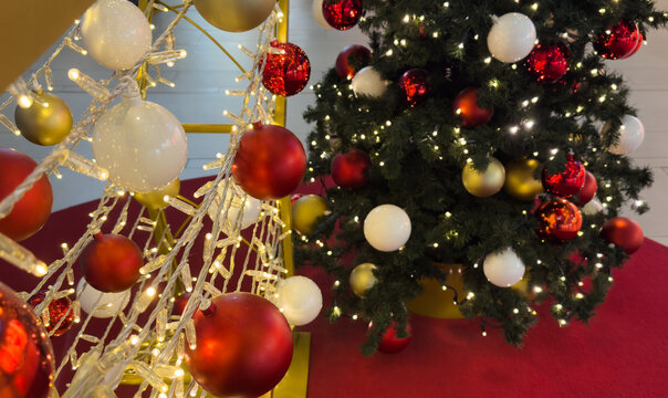 Decorated christmas tree with colorful ornaments indoors