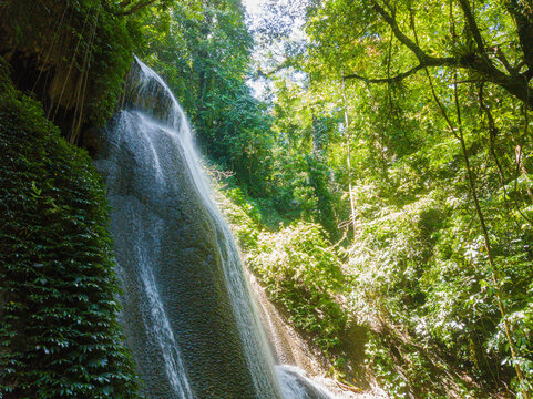 Majestic view of Embon Waterfall and river stream scenery at Pasie Raya, Aceh Jaya, Indonesia
