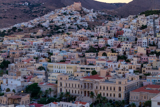 Sunset View of Ermoupoli&rsquo;s Neoclassical Town Hall and Ano Syros Above the Hillside Architecture