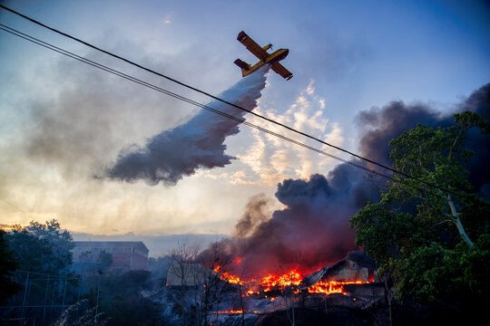 Firefighting Aircraft Attacking Intense Oraiokastro Blaze Under Drought Conditions