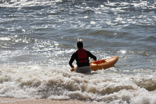  a kayak in the blue sea man kayaking he does water sports activities.
