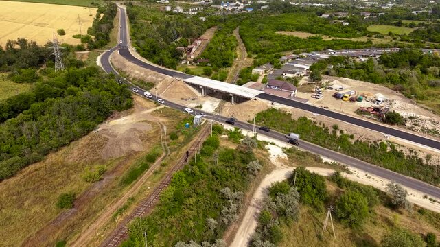 Road and bridge under repair top view aerial perspective, highway construction equipment and infrastructure renovation concept