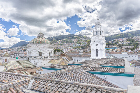 View of the dome of the Catholic church of "El Sagrario" and the bell tower of the Metropolitan Cathedral of Quito.