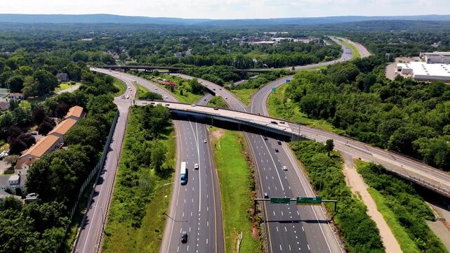 Rush hour traffic fills a major highway as vehicles travel through peak commuting hours. Perfect for transportation, urban infrastructure, commuting, mobility, congestion, and travel themes.