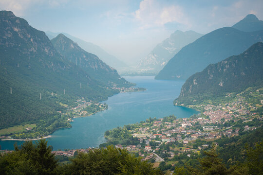 Scenic high angle view of Lago d'Idro surrounded by mountains in Italy ideal for travel advertising