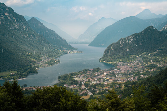 Scenic high angle view of Lago d'Idro surrounded by mountains in Italy ideal for travel advertising